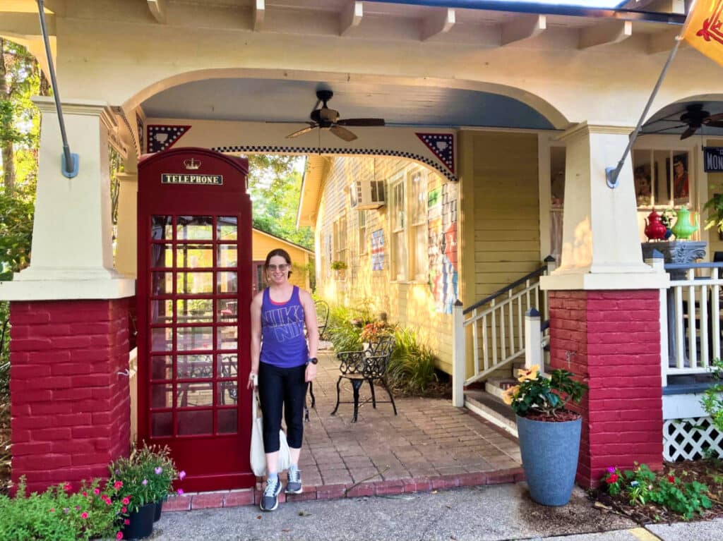 The author Meg O'Connor, posing by a phone booth outside the English Tea Room