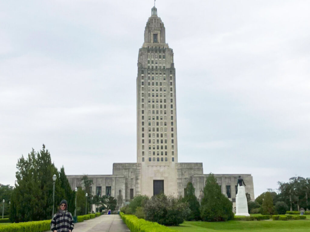 The author Meg O'Connor, standing in front of The State Capitol