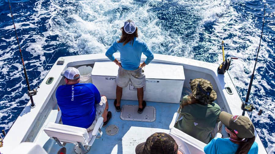 Group of men fishing on the boat