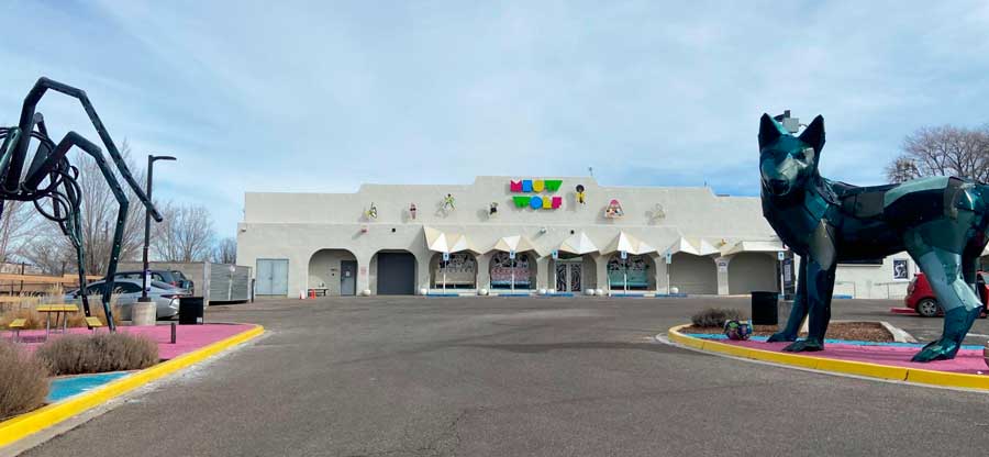 View of statues outside the Meow Wolf Santa Fe building