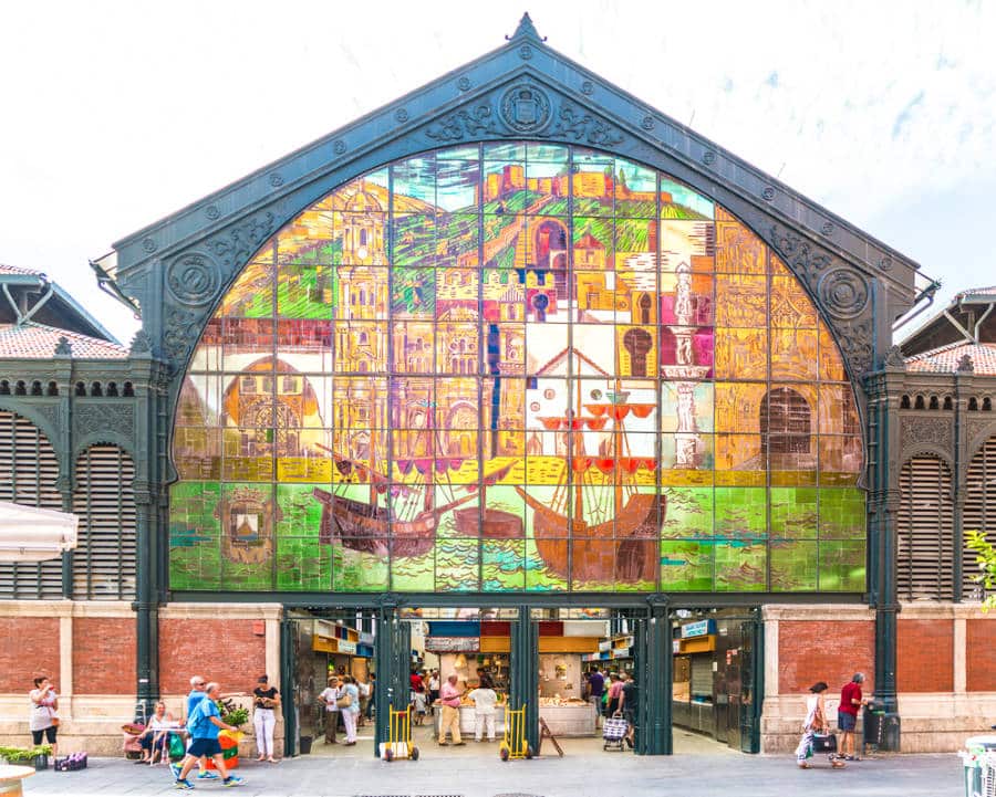 Exterior view of the colorful stained glass mural at the entrance of Mercado Central de Atarazanas