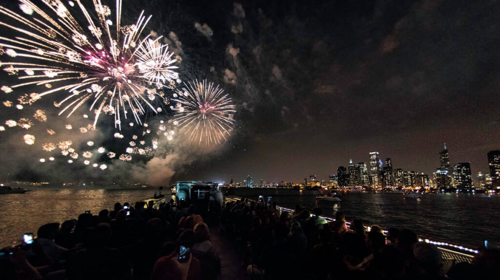 View of people on the Mercury Cruises admiring the colorful fireworks