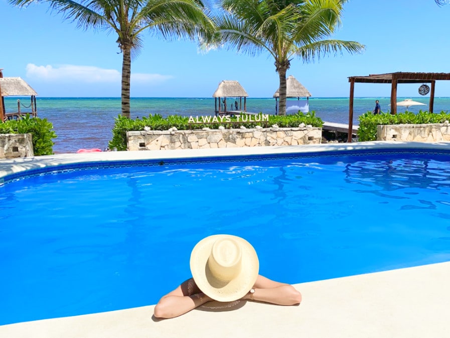 Clara wearing a hat on the pool