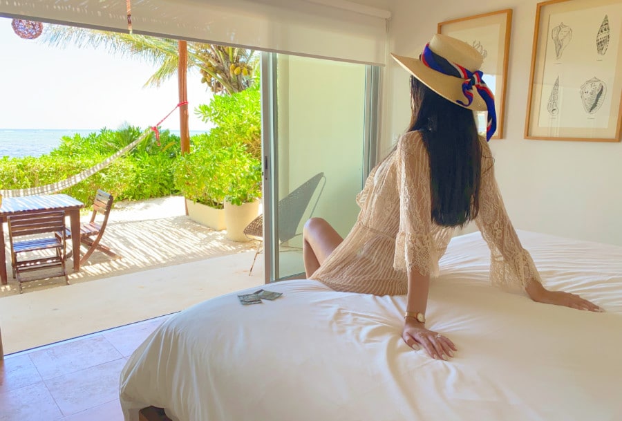 Woman on a bed at the Mereva Tulum hotel