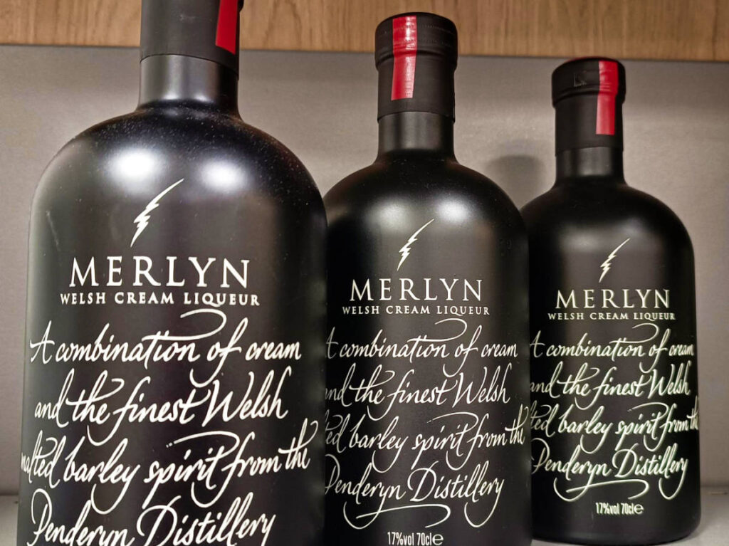 Closeup view of the black bottles of Merlyn Liqueur