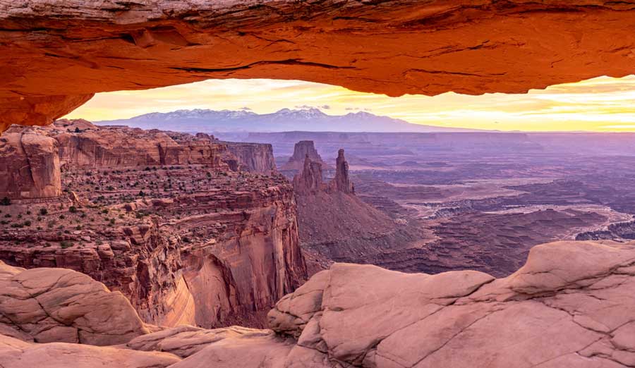 Scenic view of sunrise at the Mesa Arch Trail