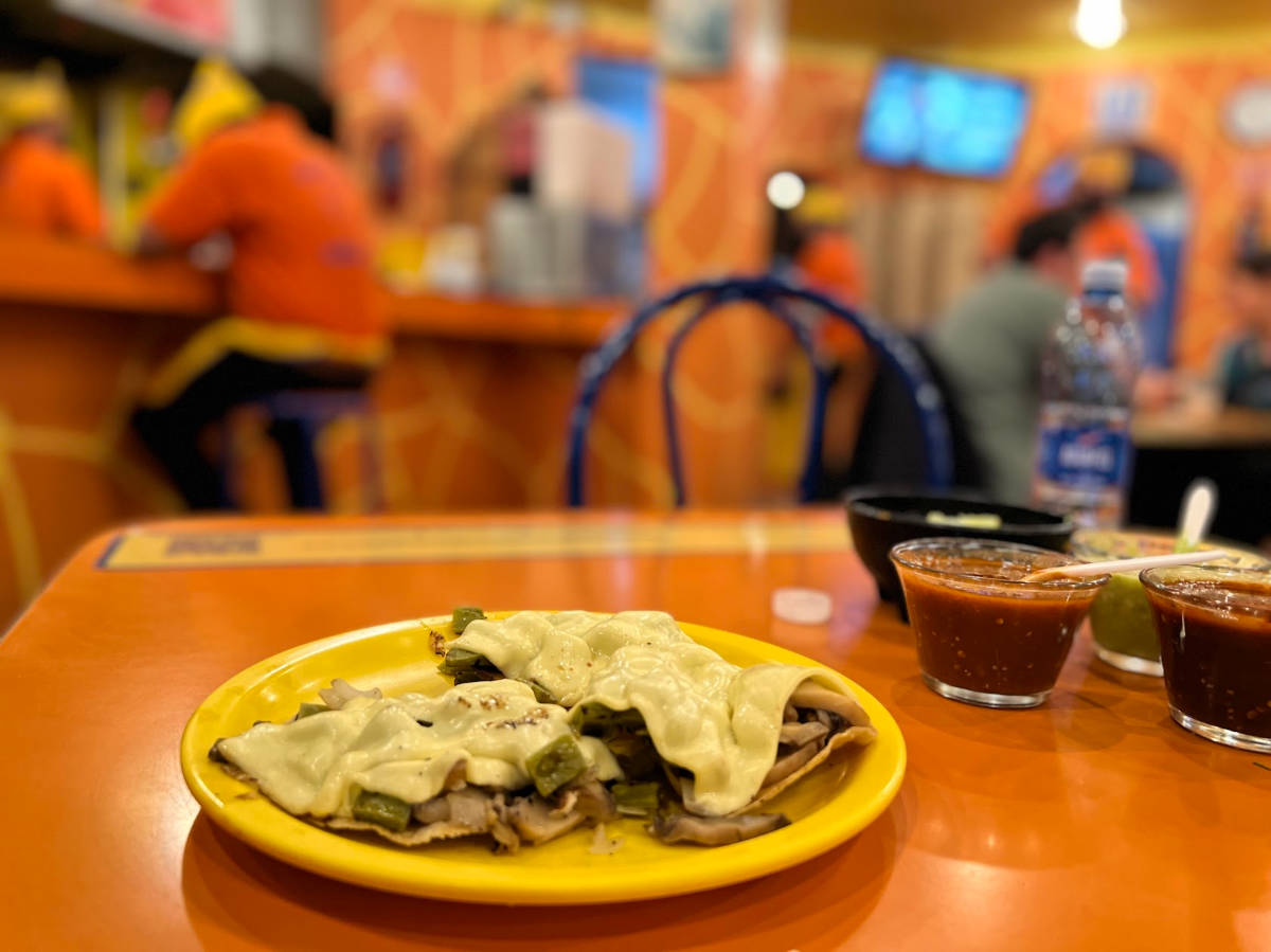 A plate of delicious Mexican food on a table at a cozy restaurant