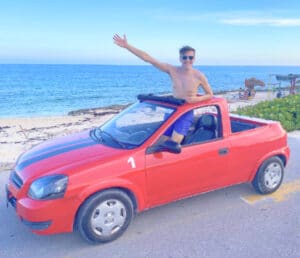 Nate in a Mexico rental car