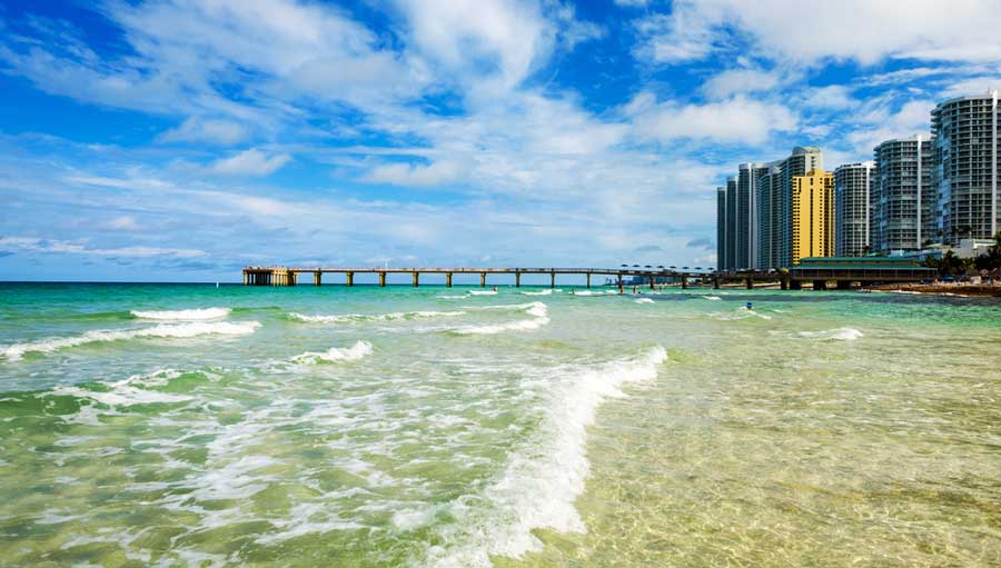 View of buildings and the blue water from Miami Beach