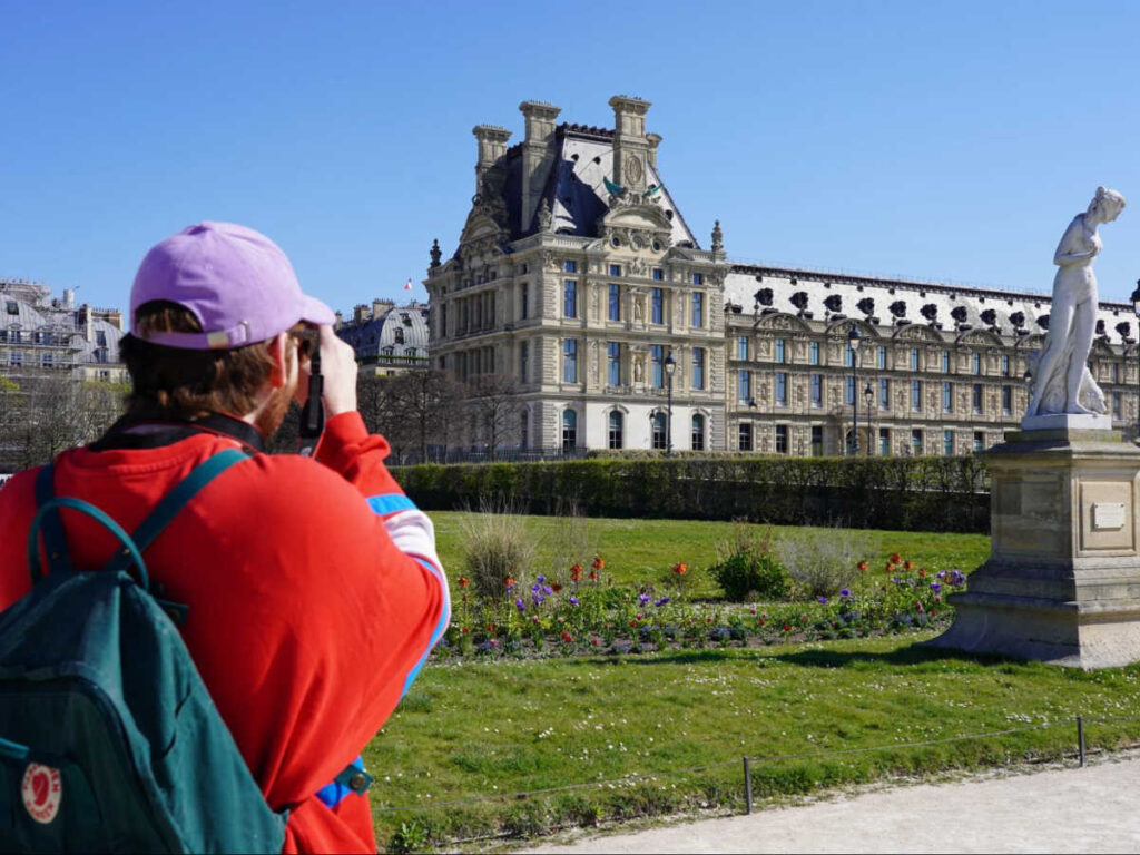 A man taking a photo of The Tuileries Gardens