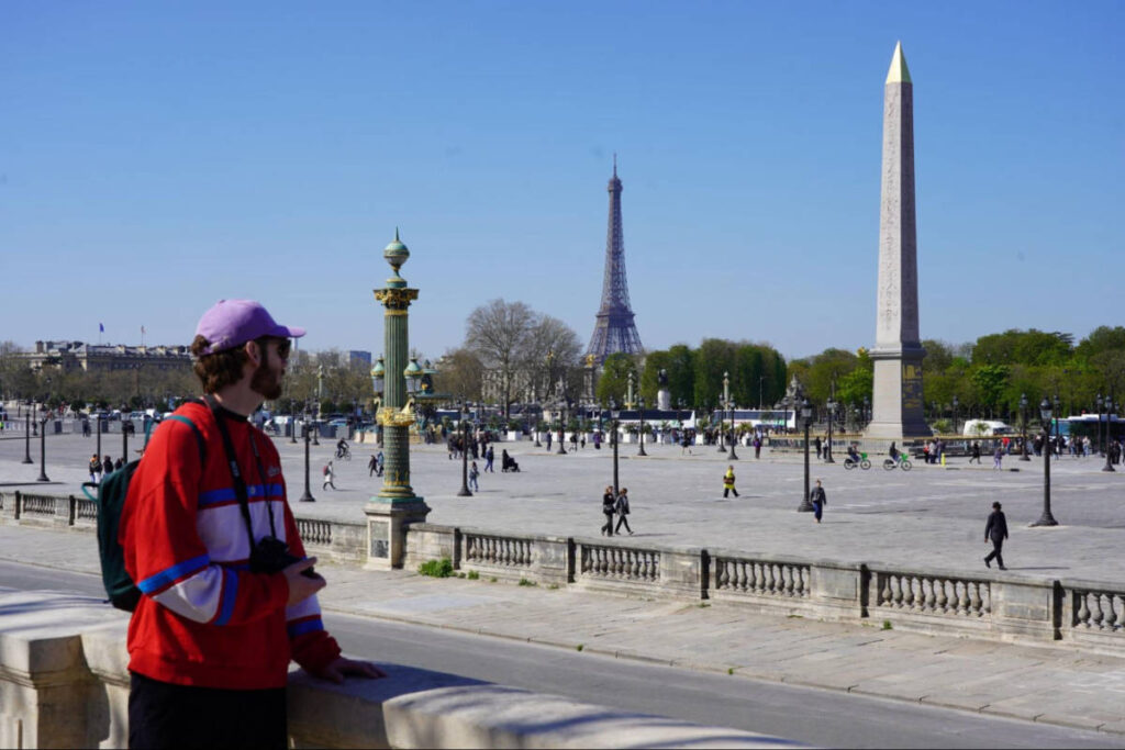 Michael admiring the Eiffel Tower from the Place de la Concorde