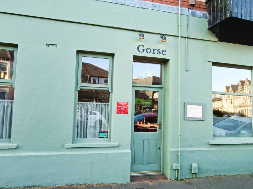 View of a red Michelin Plate at the entrance door of Gorse
