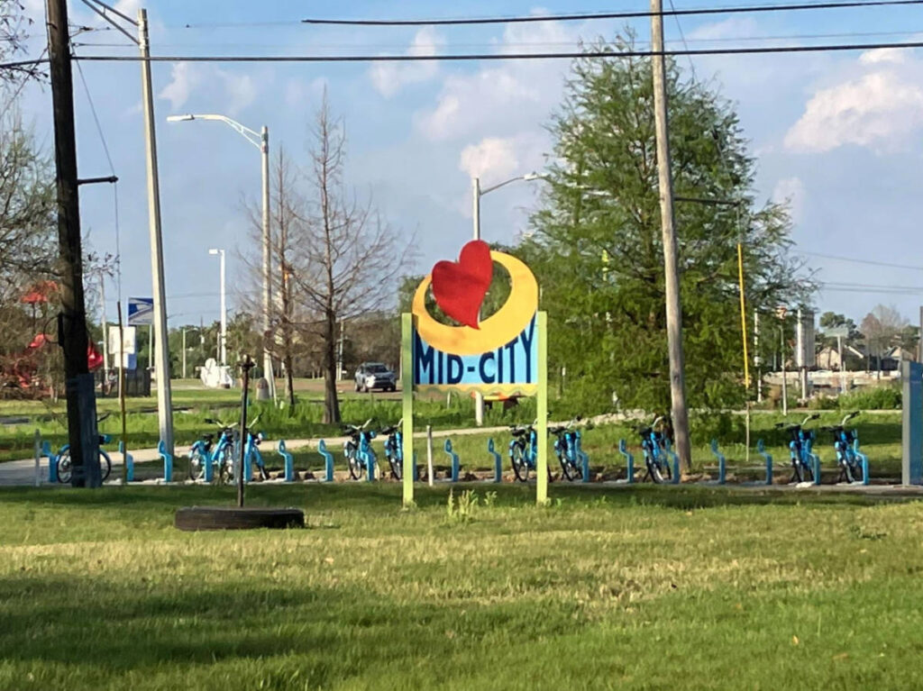 The Mid-City signage and bikes parked in its background