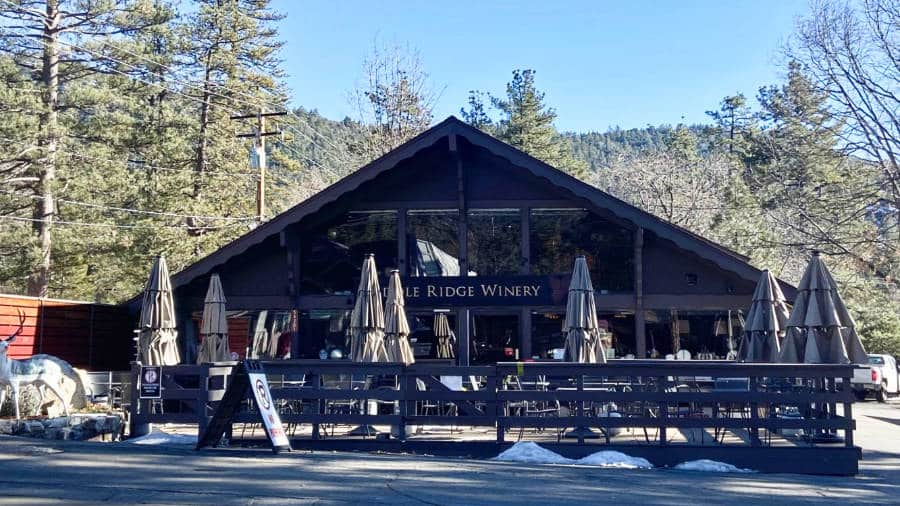 Outdoor view and façade of the cabin-like Middle Ridge Winery in a forest setting in Idyllwild
