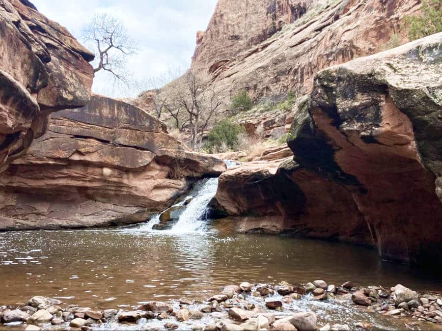 View of the small waterfalls and lake in Mill Creek Trail