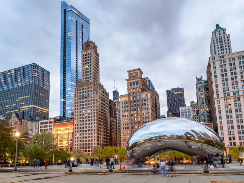 View of “The Bean” and Chicago skyline at dusk