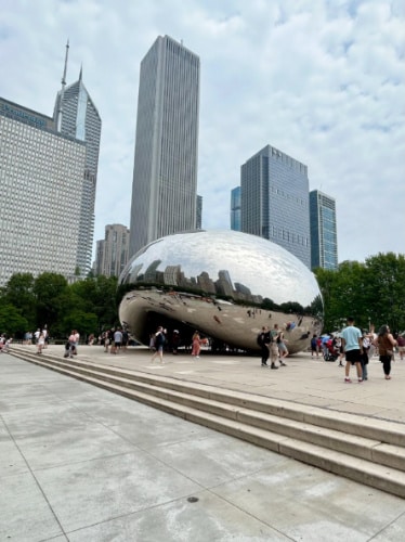 People taking a photo with "The Bean" in Millennium Park