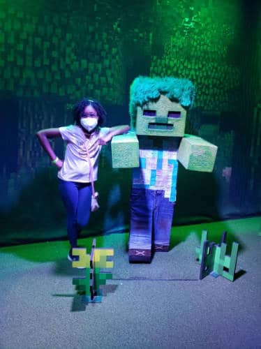 The author's daughter with a Minecraft character at the Liberty Science Center