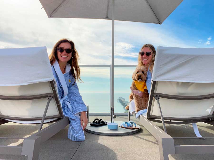 The author with her friend and dog on the balcony of Mission Pacific Hotel