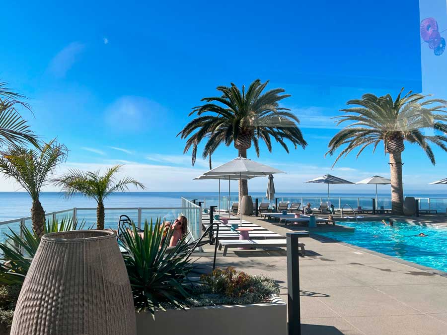 View of the pool area with ocean view in Mission Pacific Hotel