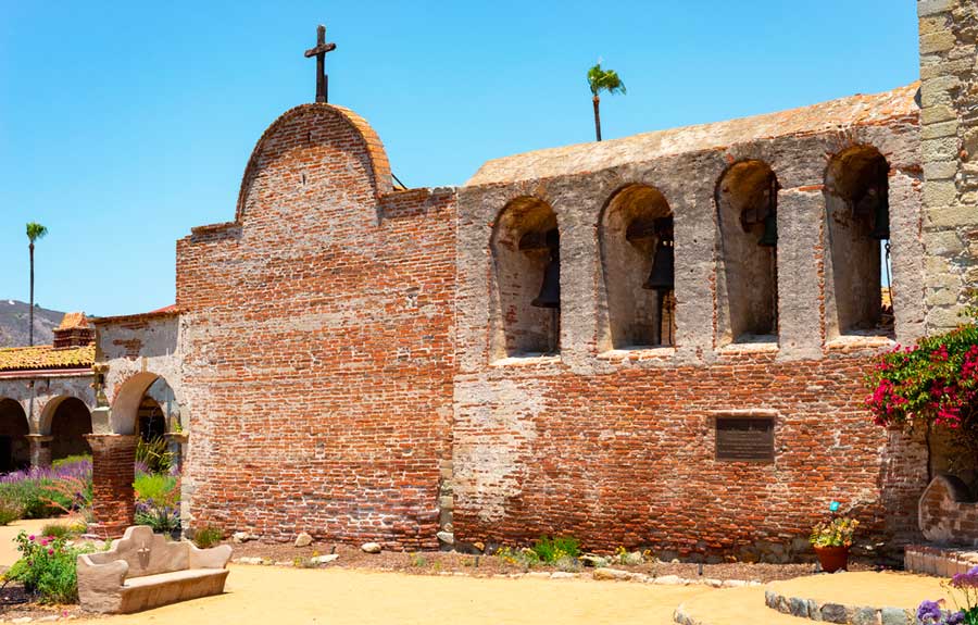 The Mission San Juan Capistrano under the clear blue sky in California