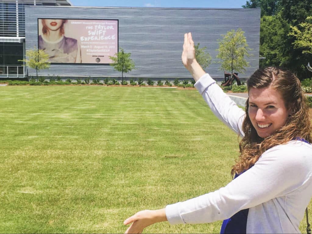 The author, Elizabeth Demolat posing for a photo outside the Mississippi GRAMMY Museum