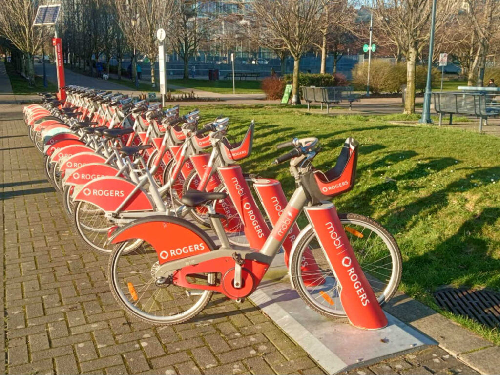 The vibrant Mobi bike rentals lined along in the park