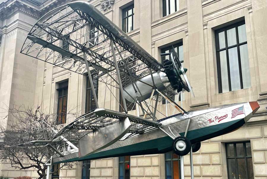 A model airplane in front of the The Franklin Institute building