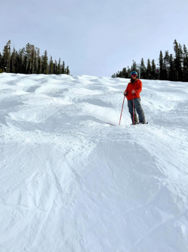 The author's husband posing for a photo in Vail