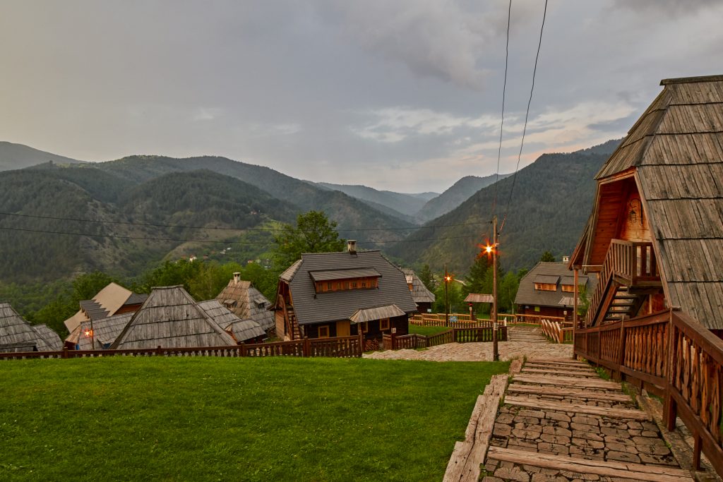 Village on mountains on sunset