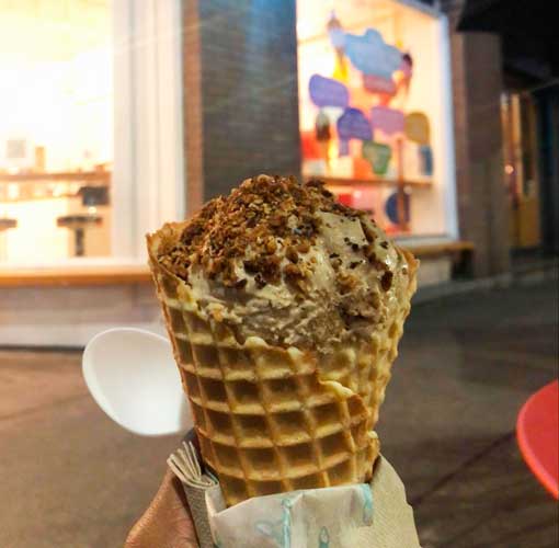 The author holding a cone of ice cream