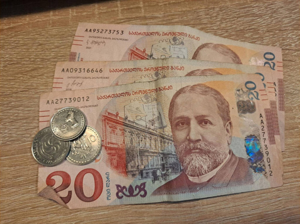 Georgian coins and bills on a table