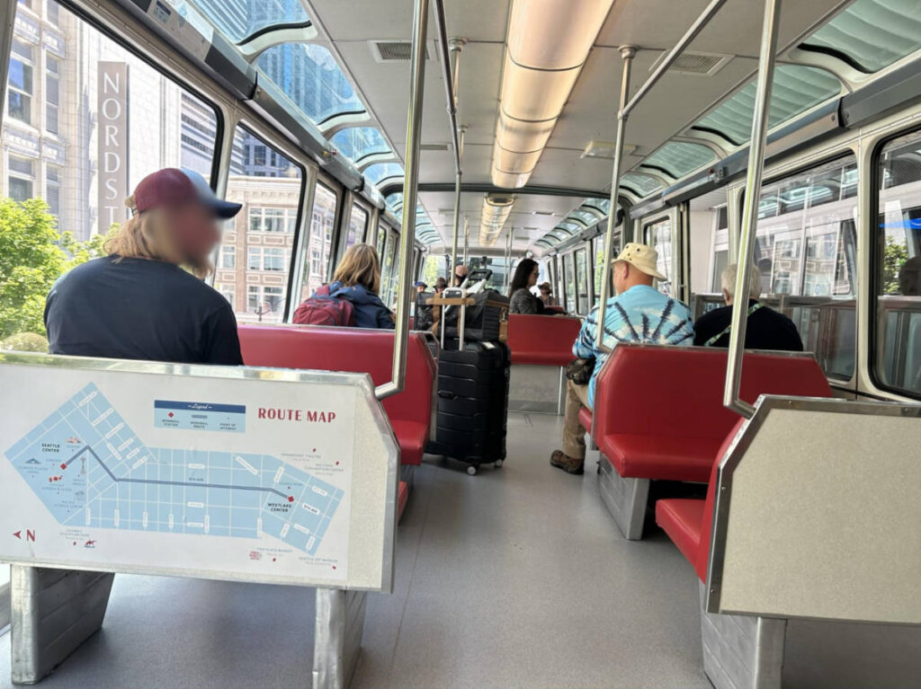 People riding the monorail around the Seattle area
