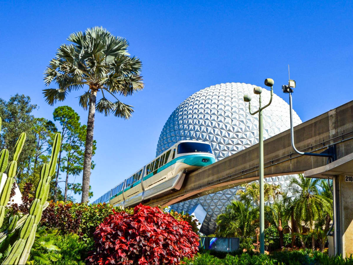 View of the monorail on a loop through Epcot with the Spaceship Earth in the background