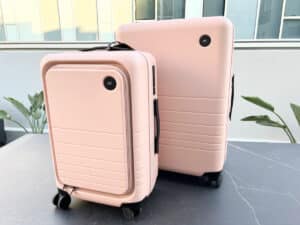 The Monos Carry-On Pro and the Check-In Medium beside each other