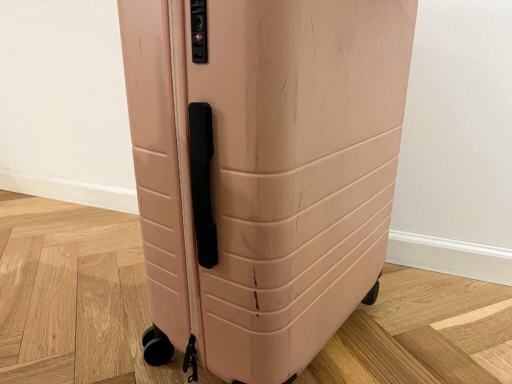 Close up look of the Monos hardshell case after one flight