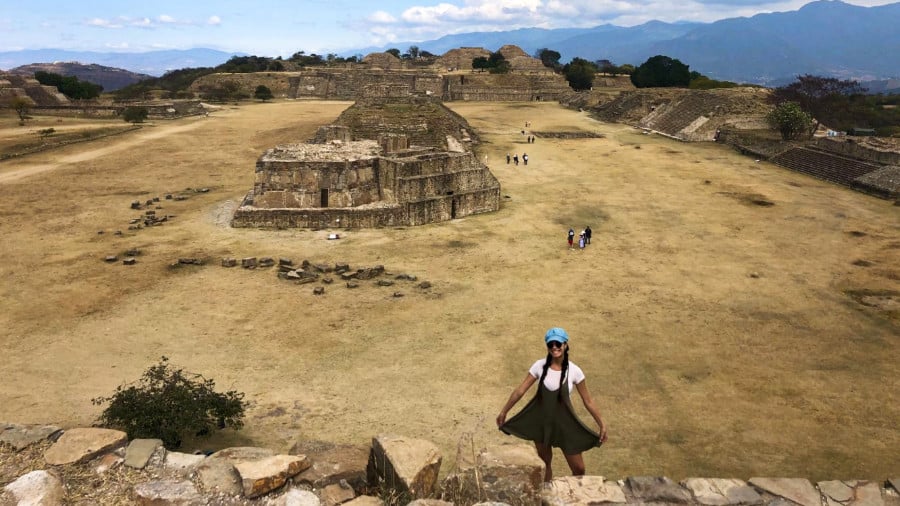 The author McKenna Mobley posing at the top of one of the Monte Alban temples