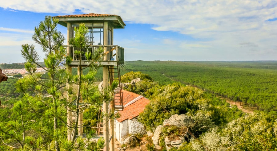 Panoramic view of the green field and a viewing deck in Monte de Sao Bartolomeu