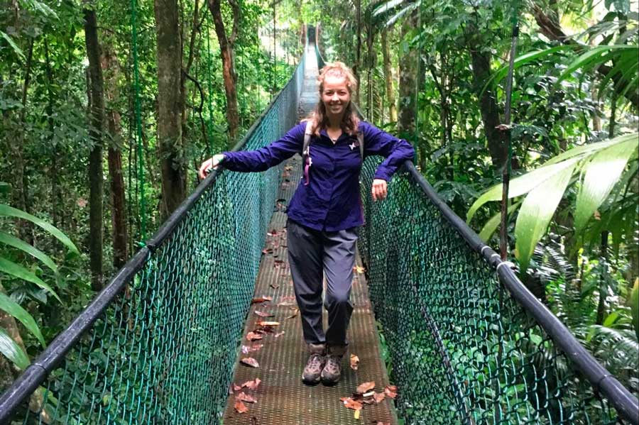 The author posing for a picture while on a bridge in Monteverde