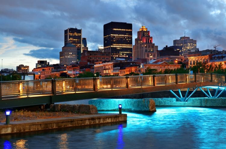 A bridge and cityscape in Montreal, Quebec at dusk