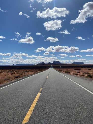 View of the empty road in Monument Valley