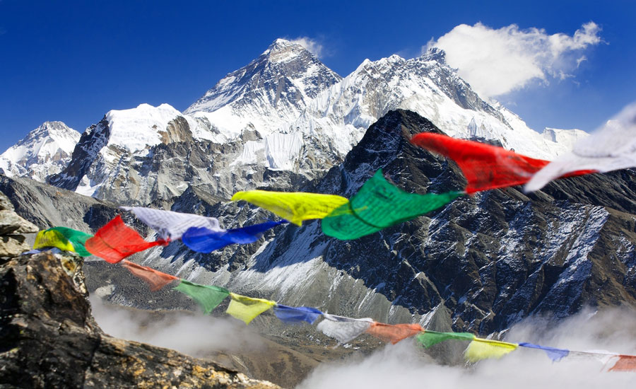 View of the Mount Everest from Nepal and some prayer flags