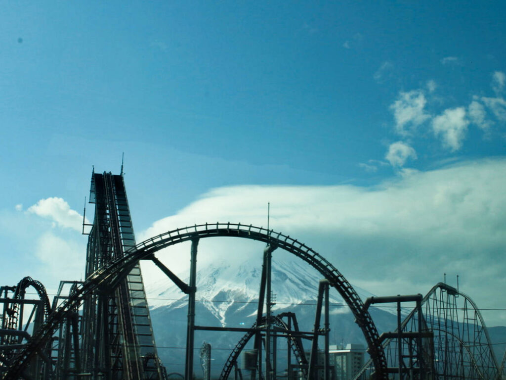 The Mount Fuji behind the rollercoaster tracks
