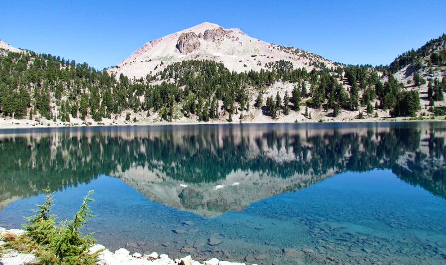 View of Mount Lassen reflected in the still water of Lake Helen