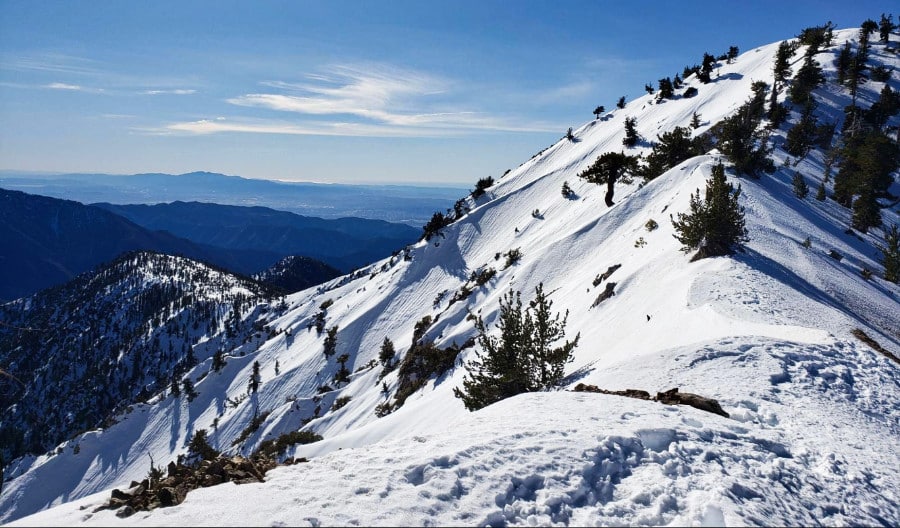 Stunning view of the snow covered mountain ranges on a sunny winter day.