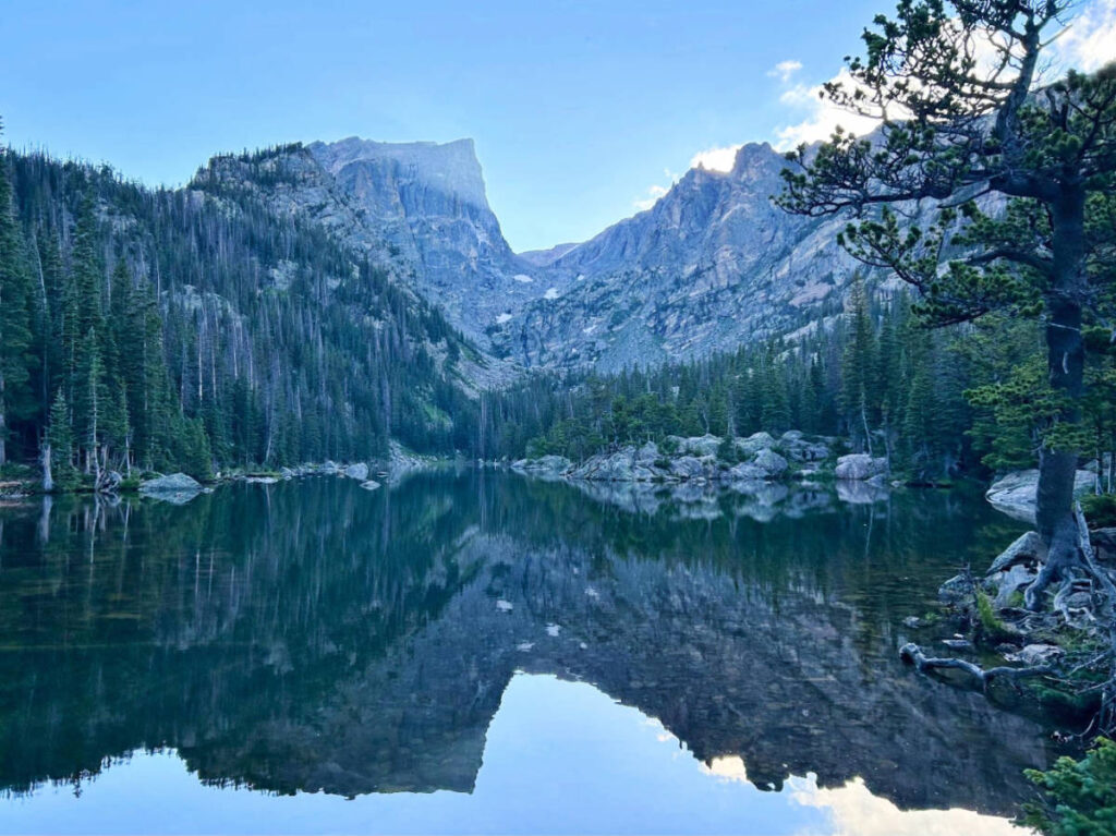 Reflection of a mountain on a body of water in Rocky Mountain National Park