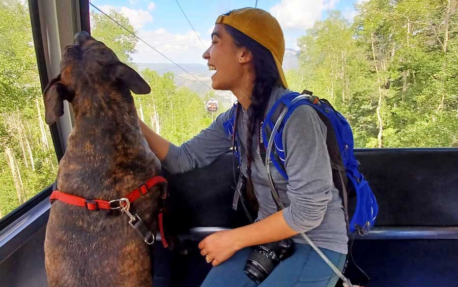 The author with her dog riding the Mountain Village Gondola