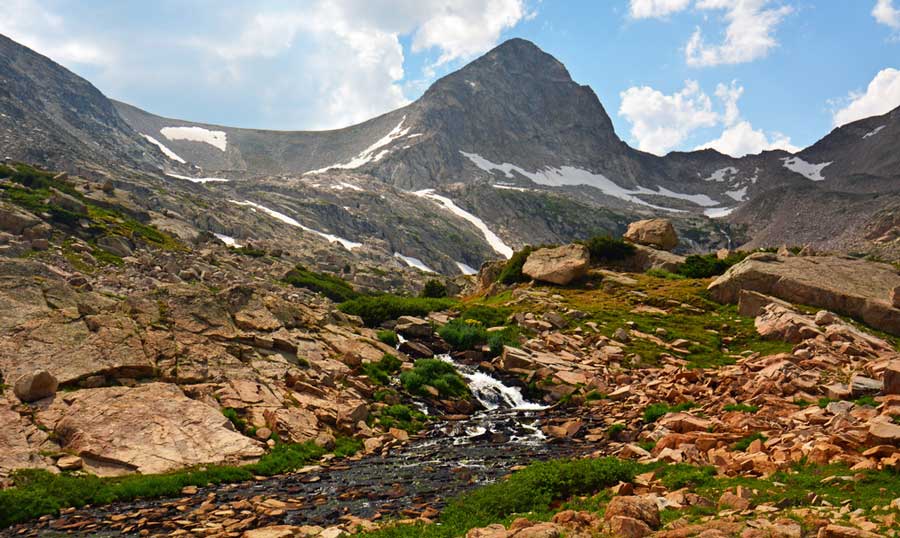 A small waterfall in between the mountains