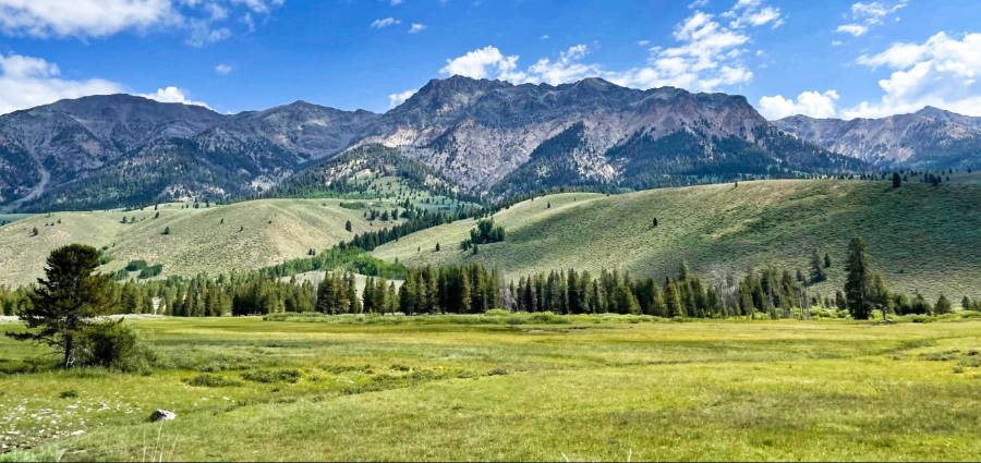 Panoramic view of the mountains and green landscape outside of Sun Valley