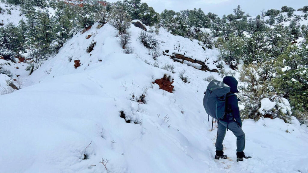 A person carrying the Mountainsmith Apex Backpack